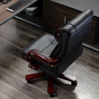 High-back leather executive chair with adjustable armrests and a sleek modern design.