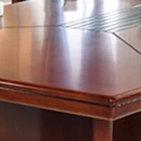 2.4m boardroom conference table with wood veneer finish and integrated cable management, ideal for corporate meetings.