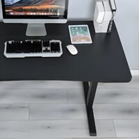 Home office height adjustable standing desk with a spacious surface and smooth electric lift mechanism.