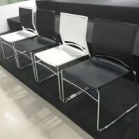 Ergonomic armless task chair with adjustable height and breathable mesh backrest.