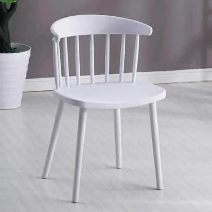 Modern plastic Windsor dining chair with a sleek design, high backrest, and sturdy tapered legs, perfect for contemporary and minimalist interiors.
