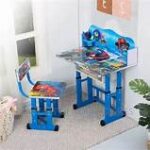 A colorful cartoon-themed kids' study desk with built-in storage, an ergonomic chair, and a spacious surface for learning and creative activities.