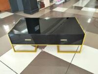 Sleek and stylish modern coffee table with a durable top and sturdy legs, perfect for contemporary living spaces.
