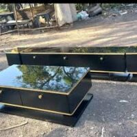 Sleek and stylish modern coffee table with a durable top and sturdy legs, perfect for contemporary living spaces.