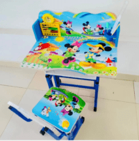 A colorful cartoon-themed kids' study desk with built-in storage, an ergonomic chair, and a spacious surface for learning and creative activities.