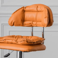 Modern faux leather alloy barstool with a cushioned seat, sturdy metal frame, adjustable height, and 360-degree swivel for stylish and comfortable seating.