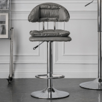 Modern faux leather alloy barstool with a cushioned seat, sturdy metal frame, adjustable height, and 360-degree swivel for stylish and comfortable seating.