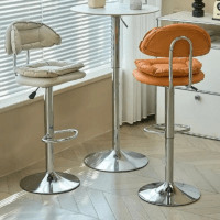Modern faux leather alloy barstool with a cushioned seat, sturdy metal frame, adjustable height, and 360-degree swivel for stylish and comfortable seating.